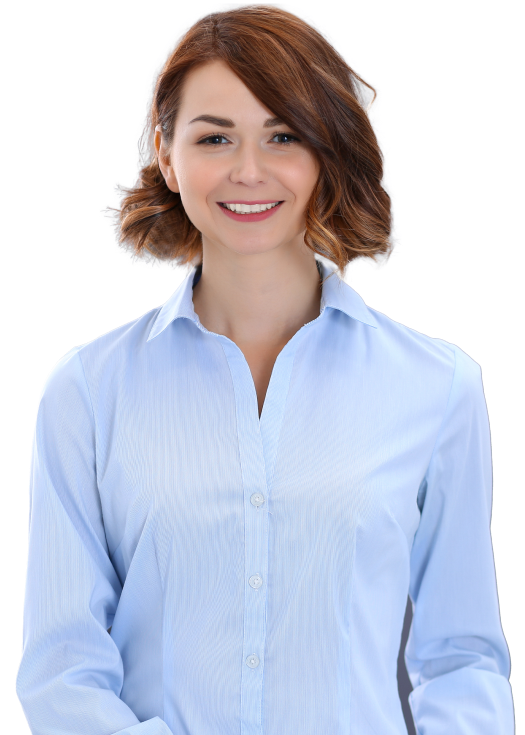 A professional smiles wearing a blue blouse